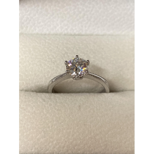 653 - A 925 SILVER SOLITAIRE RING WITH A 1 CARAT MOISSANITE STONE, SIZE N, WITH RELATED PAPERWORK, BOXED