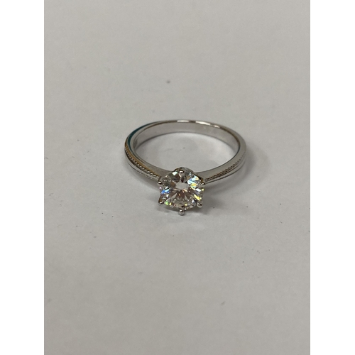 653 - A 925 SILVER SOLITAIRE RING WITH A 1 CARAT MOISSANITE STONE, SIZE N, WITH RELATED PAPERWORK, BOXED