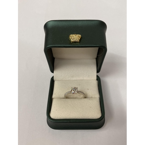 654 - A 925 SILVER SOLITAIRE RING WITH A 1 CARAT MOISSANITE STONE AND MOISSANITE TO THE SHOULDERS SIZE O, ... 