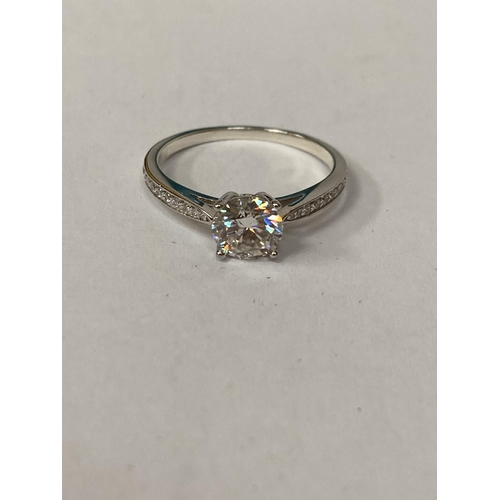 654 - A 925 SILVER SOLITAIRE RING WITH A 1 CARAT MOISSANITE STONE AND MOISSANITE TO THE SHOULDERS SIZE O, ... 