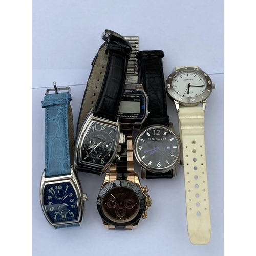 689 - SIX VARIOUS GENTS FASHION WRISTWATCHES