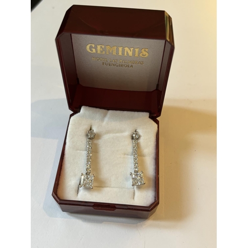 699 - A PAIR OF DROP EARRINGS WITH CLEAR STONES IN A PRESENTATION BOX