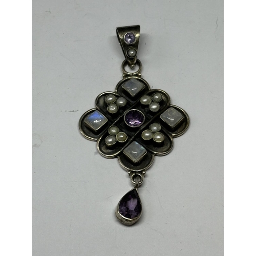 715 - A MARKED SILVER PENDANT WITH PEARLS AND COLOURED STONES