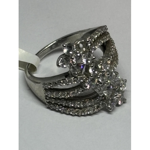 735 - A MARKED 925 SILVER RING WITH SWAROVSKI ZIRCONIAS SIZE Q IN A PRESENTATION BOX