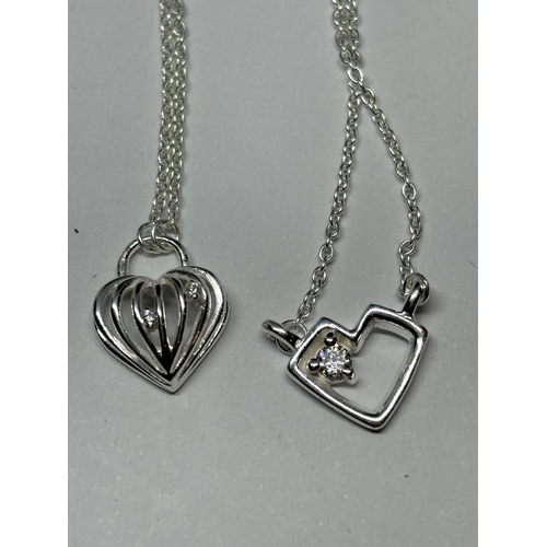 753 - FOUR SILVER PENDANT NECKLACES TOINCLUDE A GOLD PLATED EXAMPLE