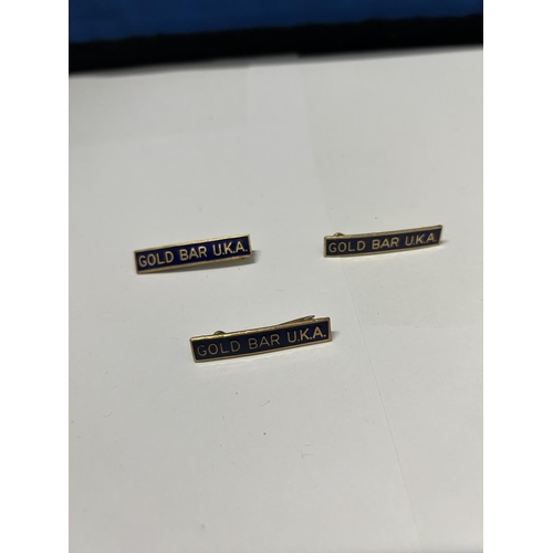 788 - THREE BLUE ENAMEL GOLD BAR U.K.A BADGES FORM THE 1970'S