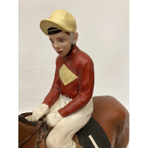 805 - A CONNOISSEUR MODEL BY BESWICK OF RED RUM BRIAN FLETCHER UP ON A WOODEN PLINTH