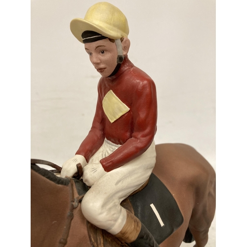 806 - A CONNOISSEUR MODEL BY BESWICK OF RED RUM BRIAN FLETCHER UP ON A WOODEN PLINTH