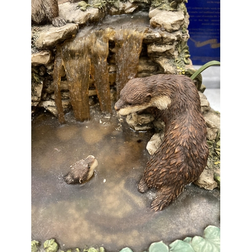 918 - A LARGE OTTER PARADISE ORNAMENT ON PLINTH PLUS PLUS PAST TIMES FAIRY