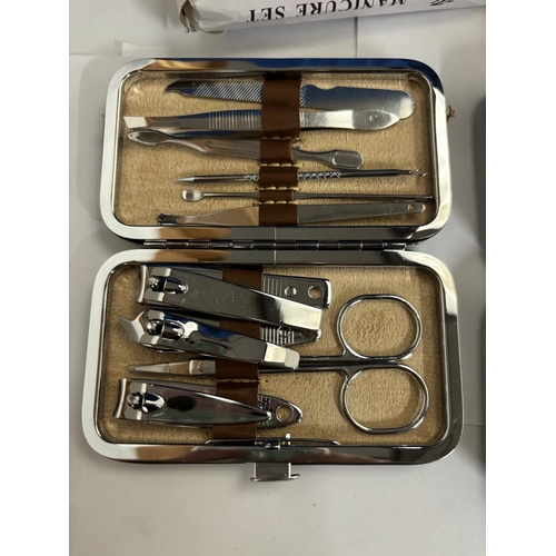 980A - TWO AS NEW AND BOXED MANICURE SETS