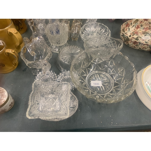 1046 - A LARGE QUANTITY OF GLASSWARE TO INCLUDE VASES, BOWLS, BELLS, TRINKET DISHES, SHOT GLASSES ETC