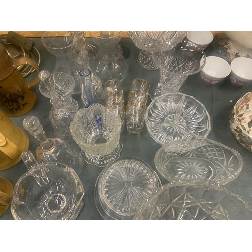 1046 - A LARGE QUANTITY OF GLASSWARE TO INCLUDE VASES, BOWLS, BELLS, TRINKET DISHES, SHOT GLASSES ETC