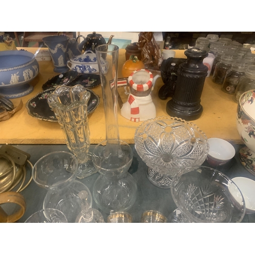 1046 - A LARGE QUANTITY OF GLASSWARE TO INCLUDE VASES, BOWLS, BELLS, TRINKET DISHES, SHOT GLASSES ETC