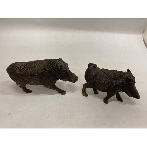 1072 - TWO CARVED WOODEN WART HOGS