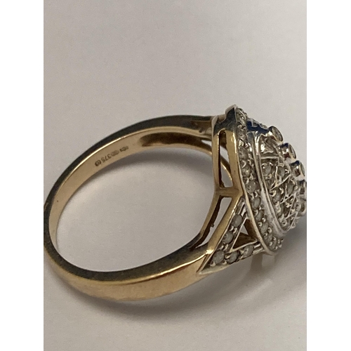 505 - A MARKED 9 CARAT YELLOW GOLD RING WITH DIAMONDS SET IN A RAISED DESIGN SIZE P/Q GROSS WEIGHT 4.41 GR... 