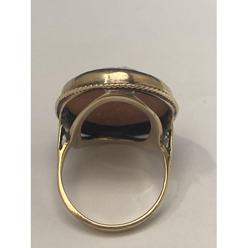 510 - A MARKED 9 CARAT YELLOW GOLD RING WITH CAMEO SIZE N/O GROSS WEIGHT 6.87 GRAMS