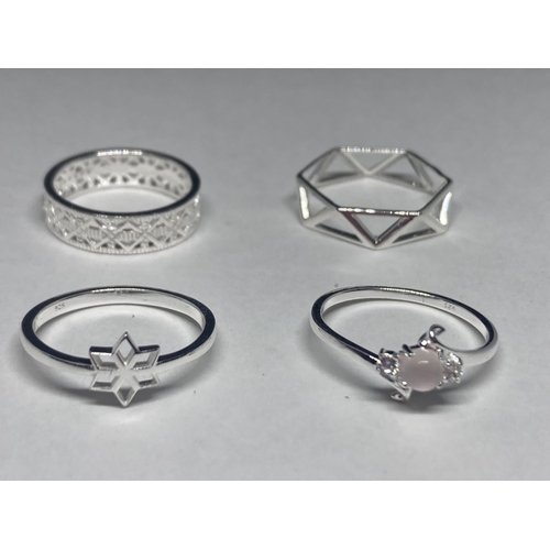 528 - FOUR VARIOUS SILVER RINGS