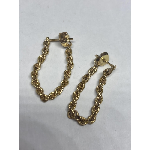 537 - TWO PAIRS OF MARKED 9 CARAT GOLD EARRINGS TO INCLUDE A ROPE DROP DESIGN AND A STUD WITH CENTRE GARNE... 