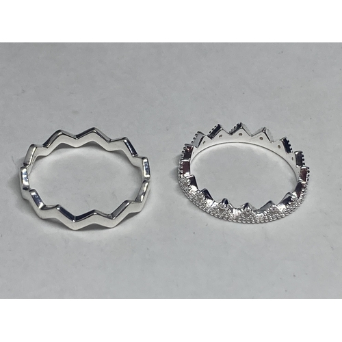 542 - FOUR VARIOUS SILVER RINGS