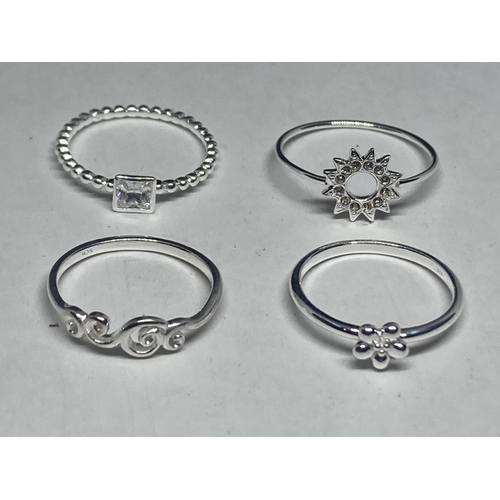 580 - FOUR VARIOUS SILVER RINGS