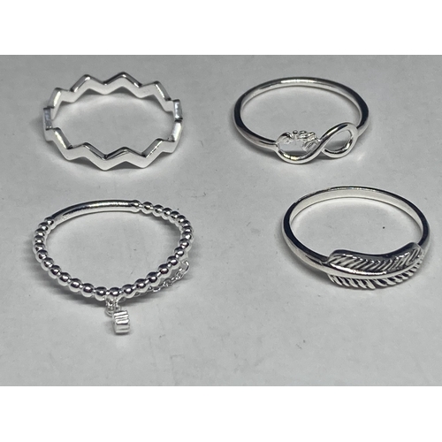 581 - FOUR VARIOUS SILVER RINGS