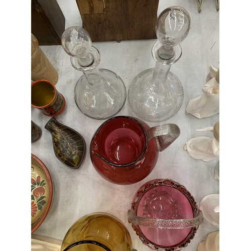 109 - A QUANTITY OF GLASSWARE TO INCLUDE CRANBERRY, JUGS, A BASKET BOWL, ART GLASS BOWL, DECANTERS, ETC