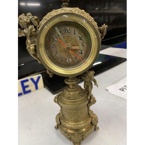 113 - A VINTAGE BRASS CHERUB MANTLE CLOCK, HEIGHT 29CM