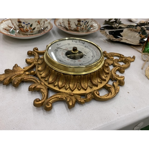 117 - A VINTAGE GILT BAROMETER