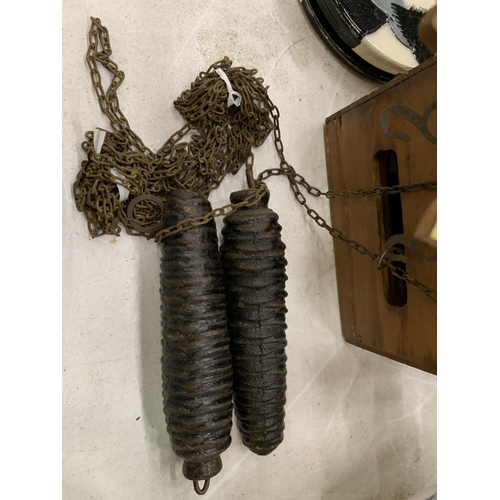 119 - A SMALL VINTAGE CHAIN DRIVEN CUCKOO CLOCK