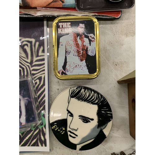 121 - A COLLECTION OF ELVIS PRESLEY ITEMS TO INCLUDE TINS, PRINTS, COASTERS, A BAR OF SOAP, ETC