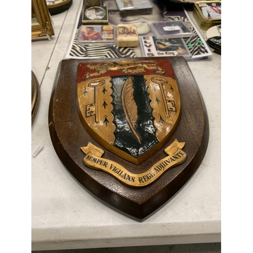 123 - A LARGE VINTAGE WOODEN SHIELD WITH A COAT OF ARMS