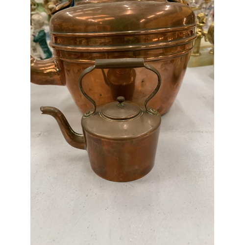 144 - TWO VINTAGE COPPER KETTLES, ONE BEING A MINIATURE