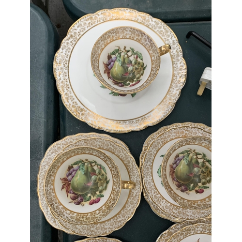 157 - A SEVENTEEN PIECE TEASET WITH ORCHARD FRUIT DESIGN WITH GOLD FILIGREE WARRANTED 22 KT GOLD