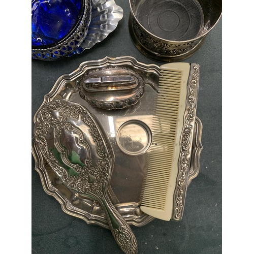 162 - A QUANTITY OF SILVERPLATE TO INCLUDE A PHOTO FRAME, A PAIR OF CANDLE STICKS, A COMB AND BRUSH THREE ... 