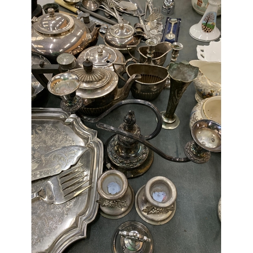 198 - A LARGE QUANTITY OF VINTAGE SILVER PLATE TO INCLUDE TEAPOTS,  JUGS, FLATWARE, CANDLESTICKS, ETC