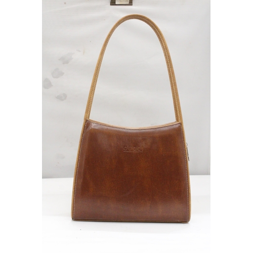 246 - A LEATHER FASHION HANDBAG