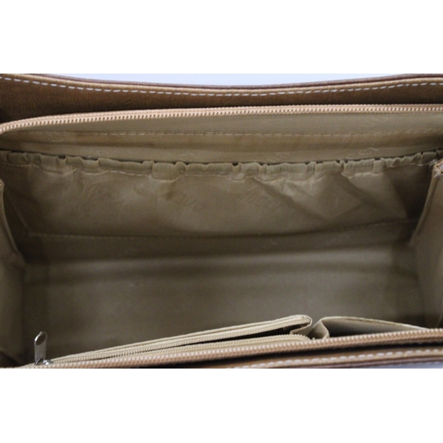 246 - A LEATHER FASHION HANDBAG