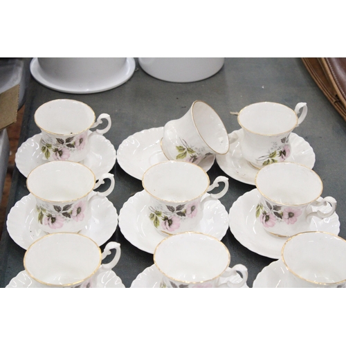 267 - A LARGE QUANTITY OF CHINA CUPS AND SAUCERS