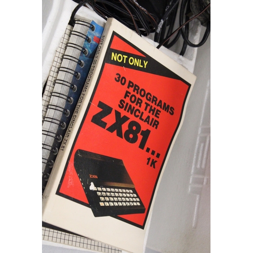 268 - A VINTAGE SINCLAIR ZX81 COMPUTER WITH POWER SUPPLY AND PROGRAMMES IN ORIGINAL BOX