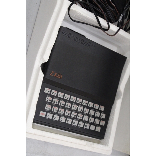 268 - A VINTAGE SINCLAIR ZX81 COMPUTER WITH POWER SUPPLY AND PROGRAMMES IN ORIGINAL BOX