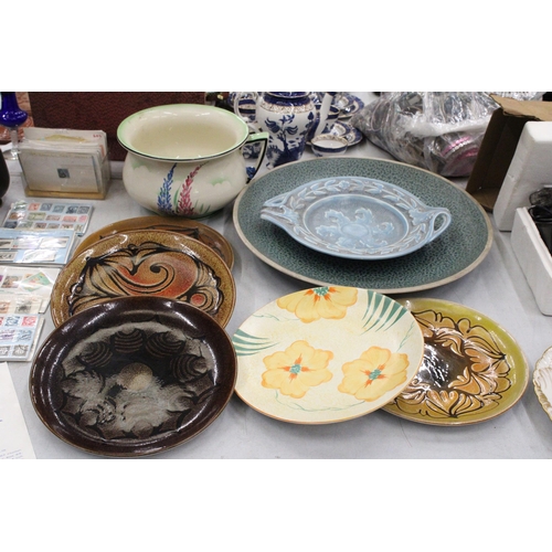 270 - A QUANTITY OF STUDIO POTTERY PLATES TO INCLUDE FOUR POOLE POTTERY, A VERY LARGE MOTTLED BLUE CHARGER... 