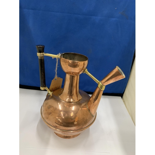 10 - A CIRCA 1889 BRASS AND COPPER EWER BY DR CHRISTOPHER DRESSER FOR BENHAM AND FROUD