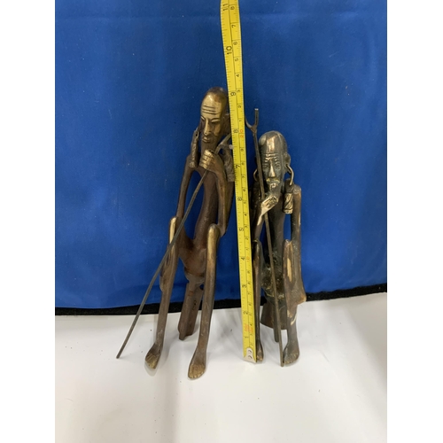 12 - TWO BRONZE AFRICAN SEATED MEN FIGURES WITH WALKING STICKS