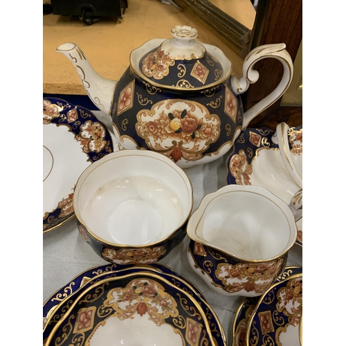 14 - A QUANTITY OF ROYAL ALBERT HEIRLOOM BONE CHINA TO INCLUDE A TEAPOT, SIGAR, MILK, TRIOS, CAKE PLATES ... 