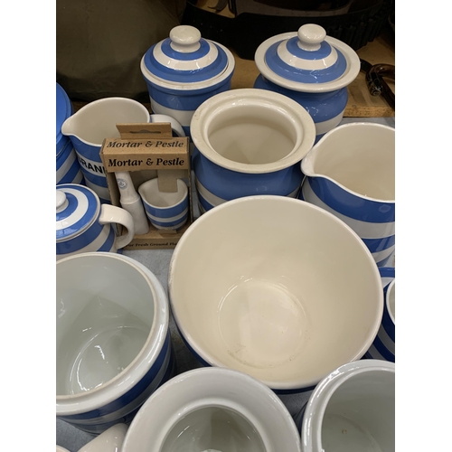 22 - A LARGE QUANTITY OF T .G. GREEN CORNISH KITCHEN WARE TO INCLUDE HERB JARS, TINS, ROLLING PINS, JUGS,... 