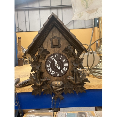 61 - A LARGE VINTAGE CHAIN DRIVEN CUCKOO CLOCK