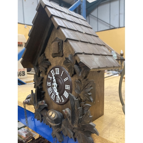 61 - A LARGE VINTAGE CHAIN DRIVEN CUCKOO CLOCK