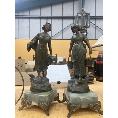 63 - TWO VINTAGE SPELTER MODELS OF GIRLS ON MARBLE BASES, HEIGHT 38CM