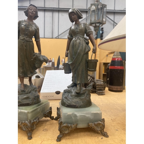 63 - TWO VINTAGE SPELTER MODELS OF GIRLS ON MARBLE BASES, HEIGHT 38CM