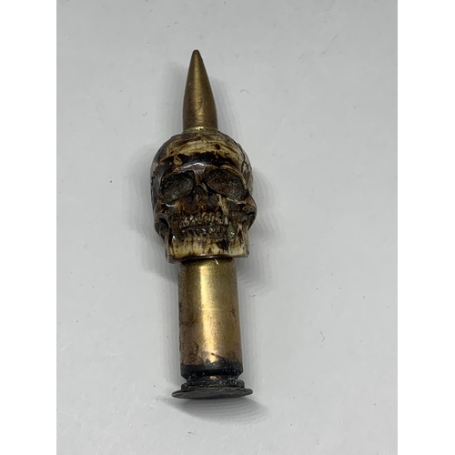 480A - A TRENCH ART BONE SKULL AND BULLET